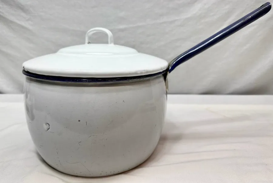Old enameled pot with lid and long handle